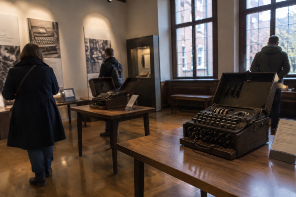 Visitors reading display panels in a quiet museum gallery