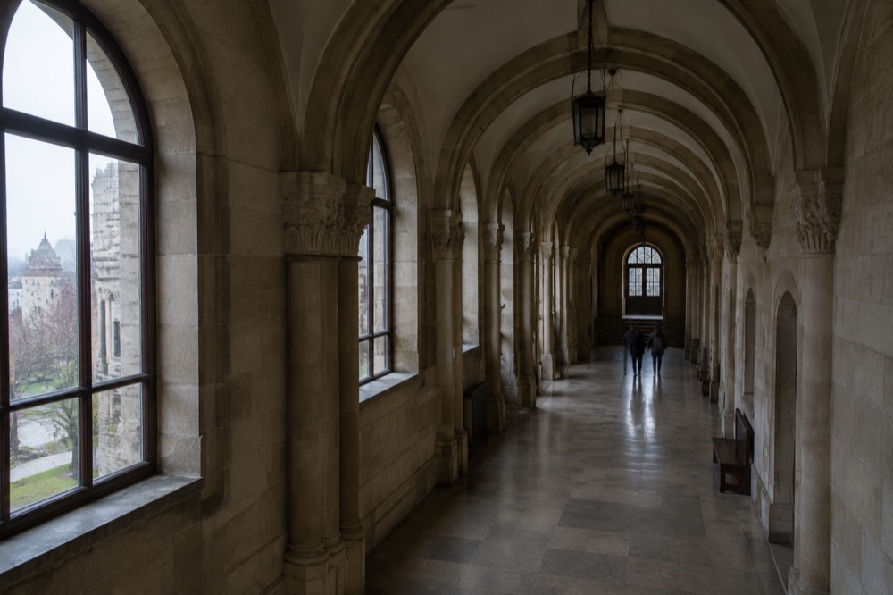 A long corridor with arched doorways inside the Imperial Castle in Poznan