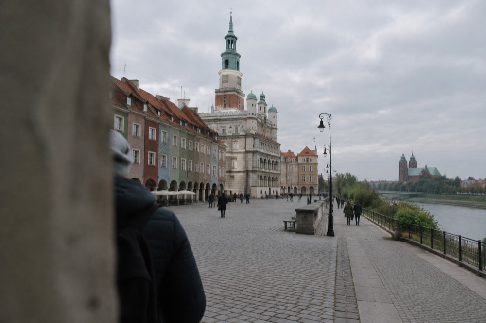 Walking path leading from the Old Market Square toward the river and cathedral island in Poznan