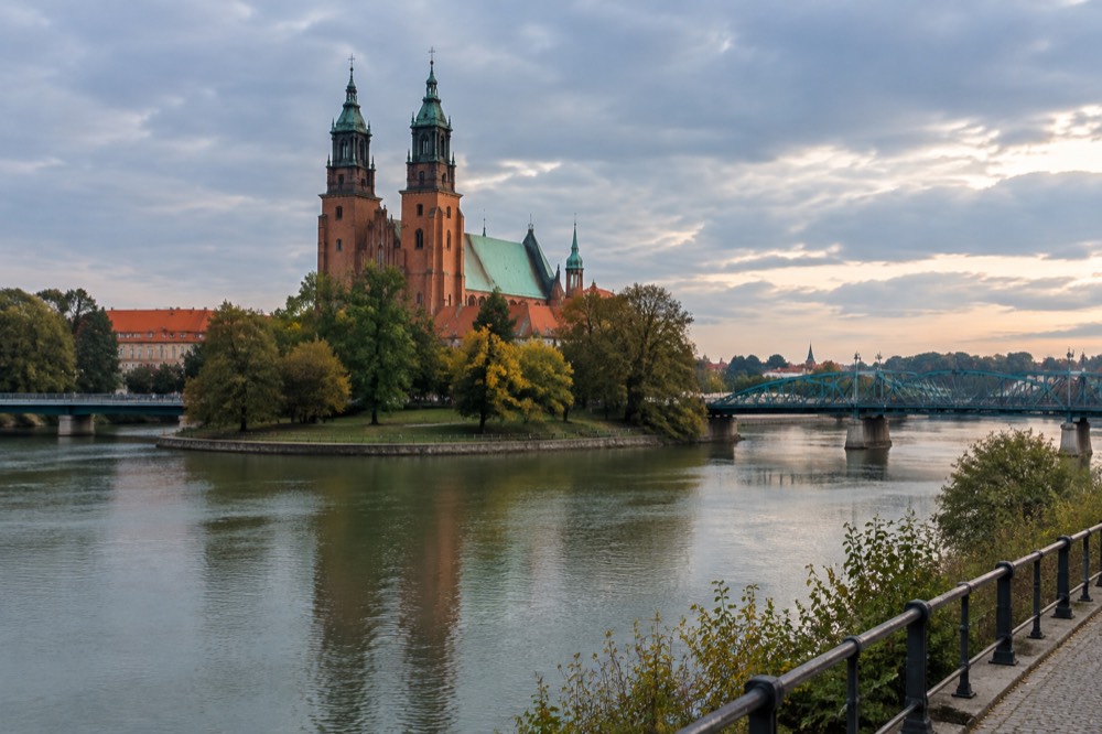 Evening panorama of Poznan Cathedral and the Warta river bridges seen from the east bank at Srodka