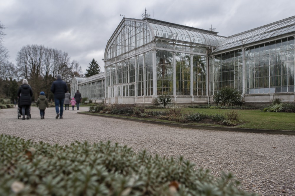 Families walking through the free Old Zoo grounds in Poznan