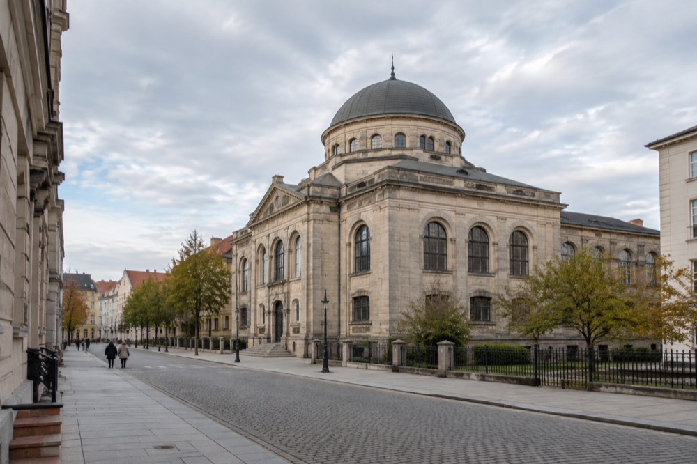 A museum gallery interior with display cases and information panels in Poznan