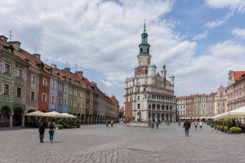 The Old Market Square in Poznan with the Town Hall tower and coloured townhouses