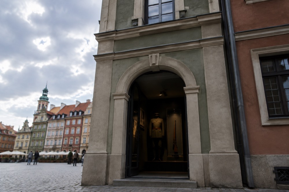 Stone classical facade of a small guardhouse museum on a market square